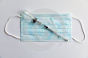 Disposable medical syringe, vaccine ampoule, protective mask