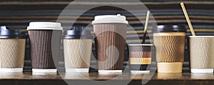 Disposable paper coffee cups in different colors and designs
