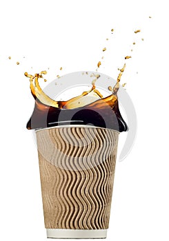 Disposable paper cup with coffee splash isolated on white background. Package for drinks