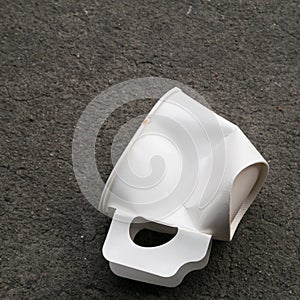 The disposable paper cup garbage (used coffee cup)