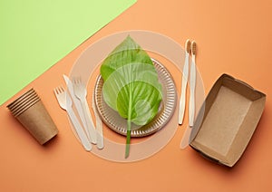 Disposable paper utensils from brown craft paper and recycled materials