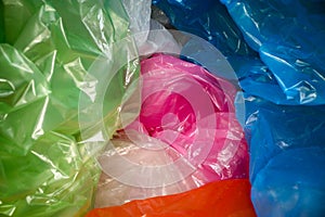 Disposable plastic bags background. Lightweight transparent, reusable plastic waste. Rubbish bags, plastic recycling