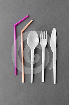 Disposable plastic fork, knife, spoon and straws