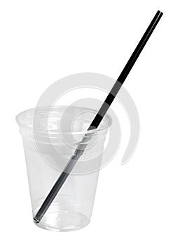 Disposable plastic glass with a drinking straw isolated on white. Close-up.