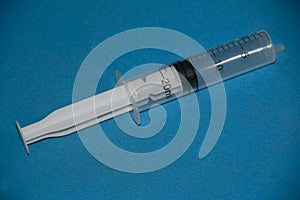 Disposable plastic syringe without a needle