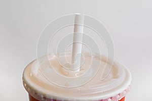 Disposable straw on a cup