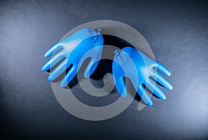 Disposable surgical gloves, Flat-lay. Corona virus concept. Medical blue glowes