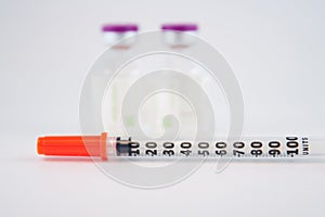 Disposable syringe on injection vials