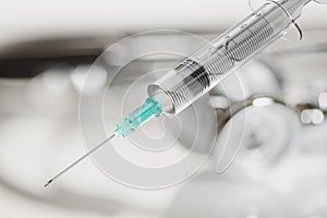 Disposable syringe for vaccine injection on gray background