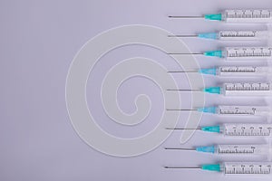 Disposable syringes with needles on white background, flat lay. Space for text