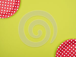 Disposable tableware for a holiday on a colored background.