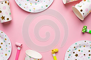 Disposable tableware for holidays.A set of plastic disposable dishes for a picnic. View from above. Plates, glasses and forks for