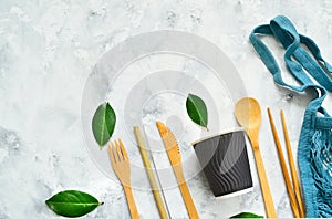 Disposable tableware made of environmental materials. Paper, bamboo glasses, cocktail tubes. Wooden forks and knives. Plastic free