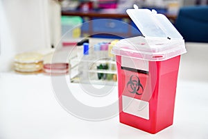 Disposal container; reducing medical waste disposal.