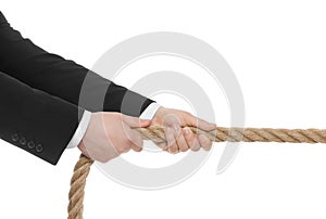 Dispute concept. Man pulling rope on white background, closeup