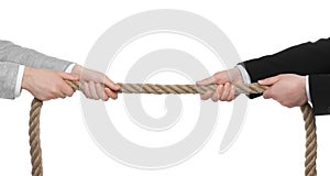 Dispute concept. Men pulling rope on white background, closeup