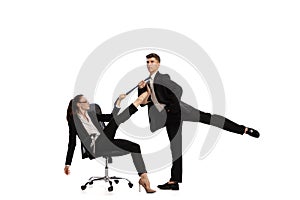 Disputed issues. Two stylish office workers in business suits in action isolated on white background. Art, beauty
