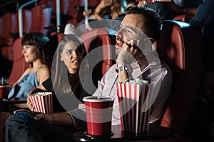 Disrespectful man in a movie theater photo