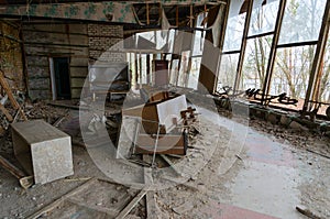 Disruption in cafe Pripyat on embankment in abandoned ghost town of Pripyat, Chernobyl NPP alienation zone, Ukrain photo