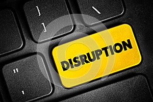 Disruption - disturbance or problems which interrupt an event, activity, or process, text concept button on keyboard photo