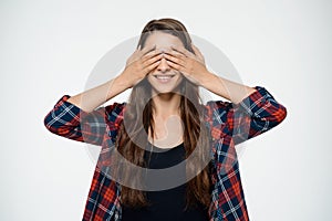 Dissapointed young girl covering her eyes.