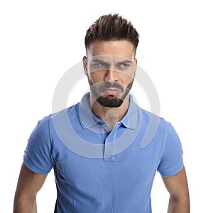 Dissapointed young man looking at a side