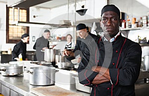 Dissatisfied african american male chef in kitchen of restaurant