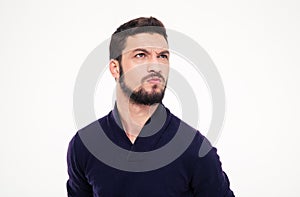 Dissatisfied frowning handsome young man with beard in sweetshirt
