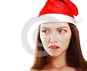 Dissatisfied girl in Santa's hat