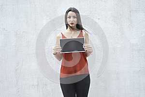 Dissatisfied woman holding a plate