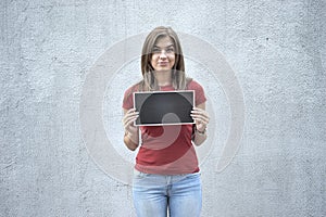 Dissatisfied woman holding a plate