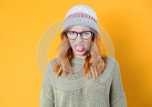 Dissatisfied young woman has disgusting expression on face, isolated on white background