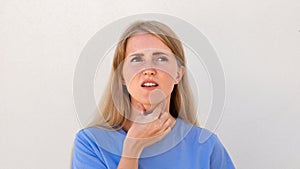 Dissatisfied young woman suffering from sore throat