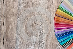 Dissolved in fan colour spectrum on wooden desk background