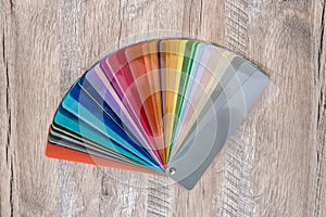 Dissolved in fan colour spectrum on wooden desk background