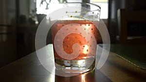 Dissolving Aspirin fizzy pill in glass of water