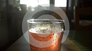 Dissolving Aspirin fizzy pill in glass of water