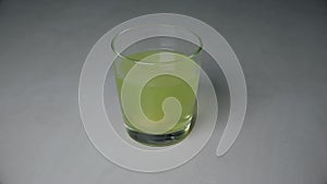 Dissolving effervescent tablet in water glass