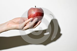 Dissonance Concept. Apple Fruit and Pear Fruit Shadow photo