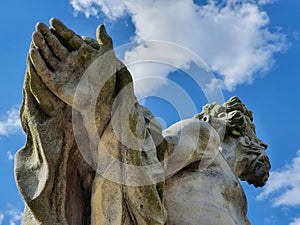 A dissuasive hand gesture, detail of a baroque statue of the ancient god Jupiter by Matthias Bernard Braun in Prague`s Vrtbovska