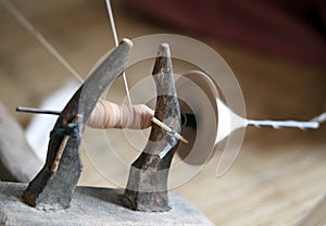 Distaff, spinning yarn on spinning wheel