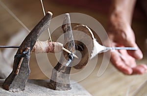 Distaff, spinning yarn on spinning wheel