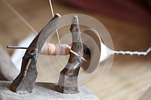 Distaff, spinning yarn on spinning wheel