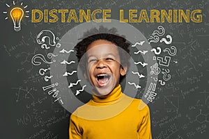 Distance education. Black child student with idea light bulb, question marks and science formulas