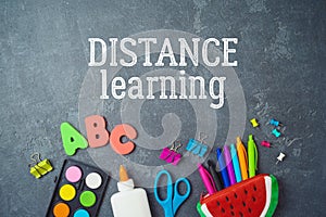 Distance learning and education concept. Study online from home with top view table and school supplies