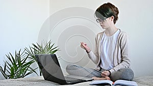 Distance learning online education. Teen schoolgirl studying home using laptop
