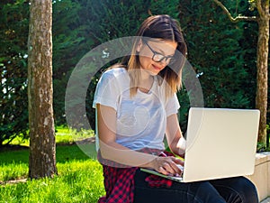 Distance learning online education. Woman with laptop outdoors. Startup business