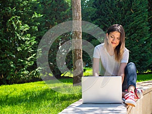 Distance learning online education. Woman with laptop outdoors. Startup business