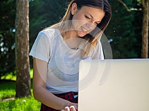 Distance learning online education. Woman with laptop outdoors. Startup business