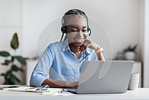 Distance Learning. Young Black Woman In Headset Watching Webinar On Laptop